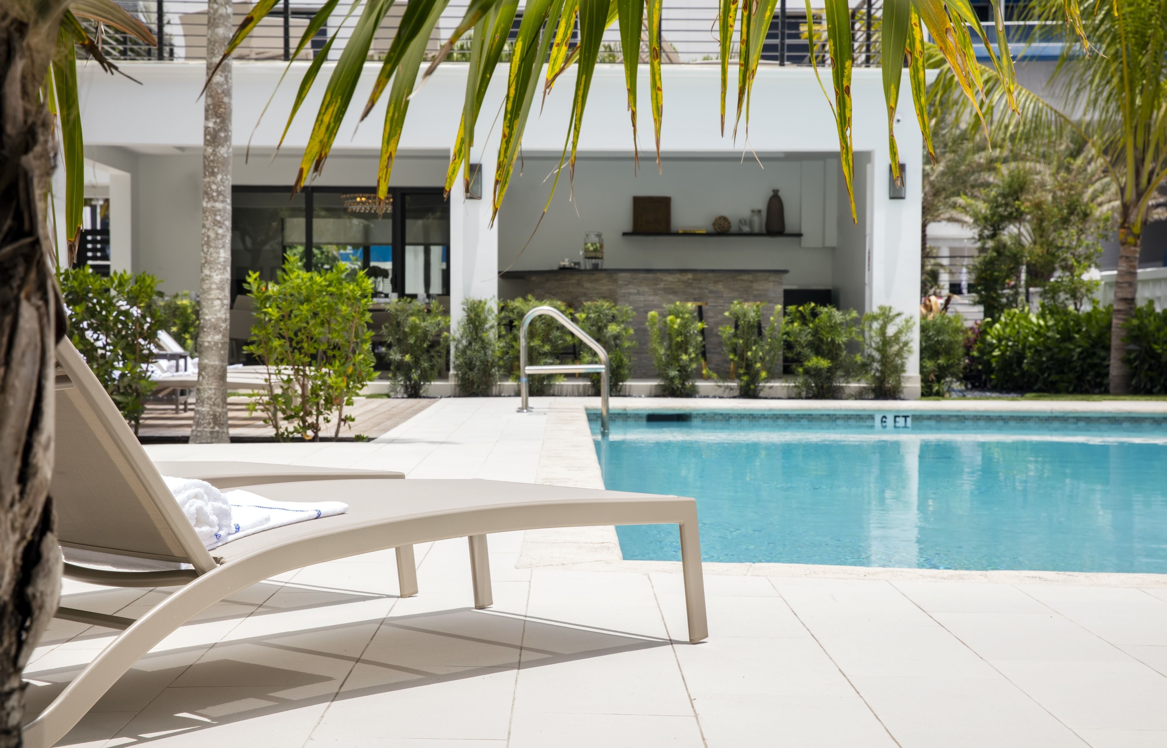 outdoor pool, open 8:00 am to 7:30 pm, pool loungers