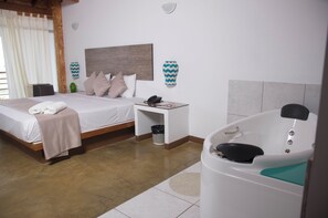 Double Room, Jetted Tub | Minibar, in-room safe, desk, iron/ironing board