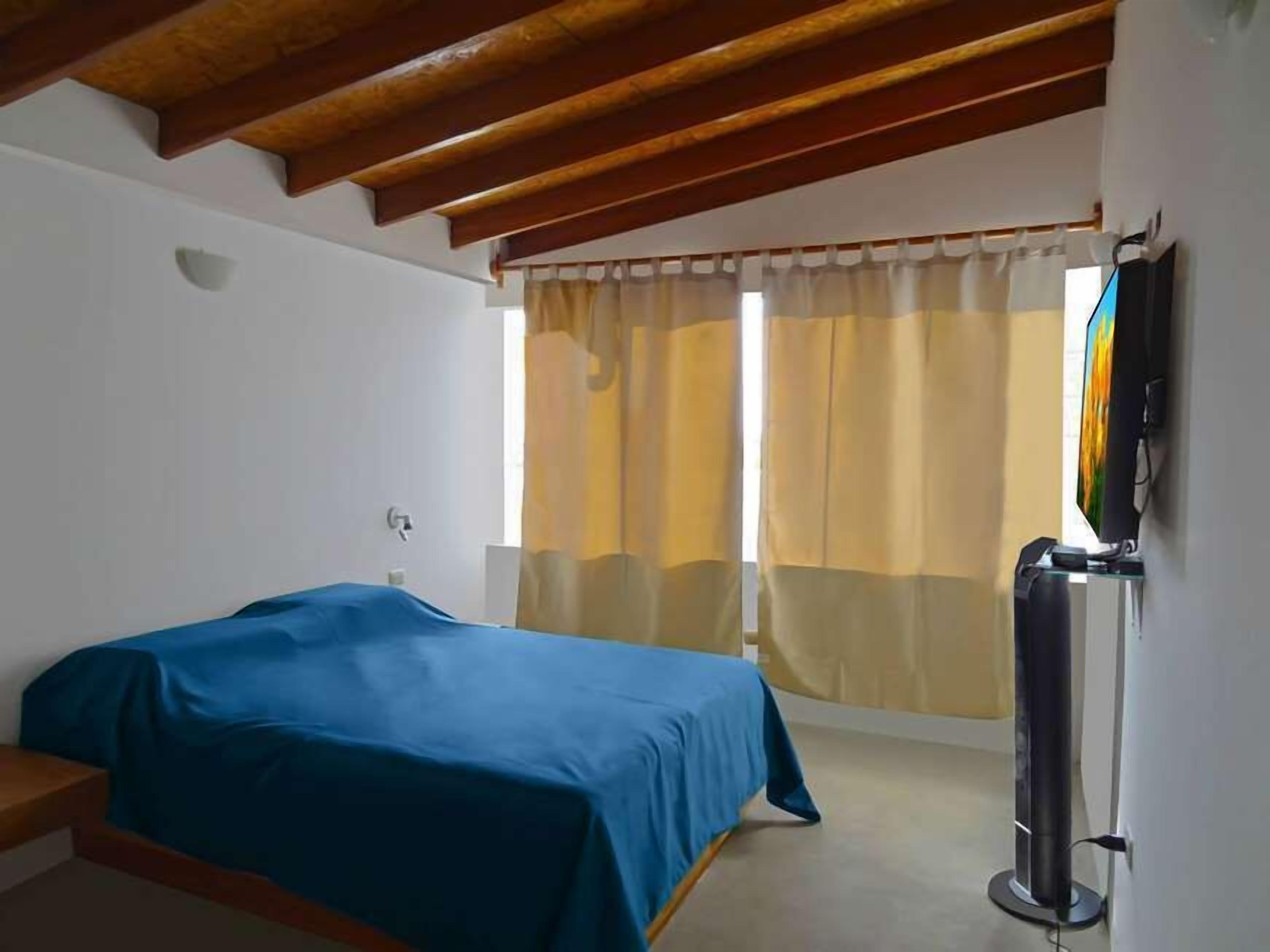 apartment, sea view | minibar, in-room safe, desk, iron/ironing board