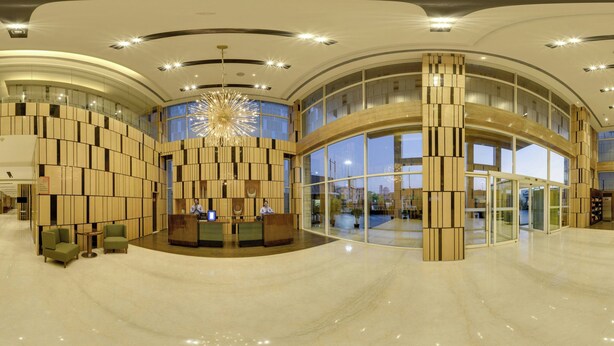 A spacious lobby with a reception desk, seating area, and large windows. - Fairfield By Marriott Lucknow (Lucknow)