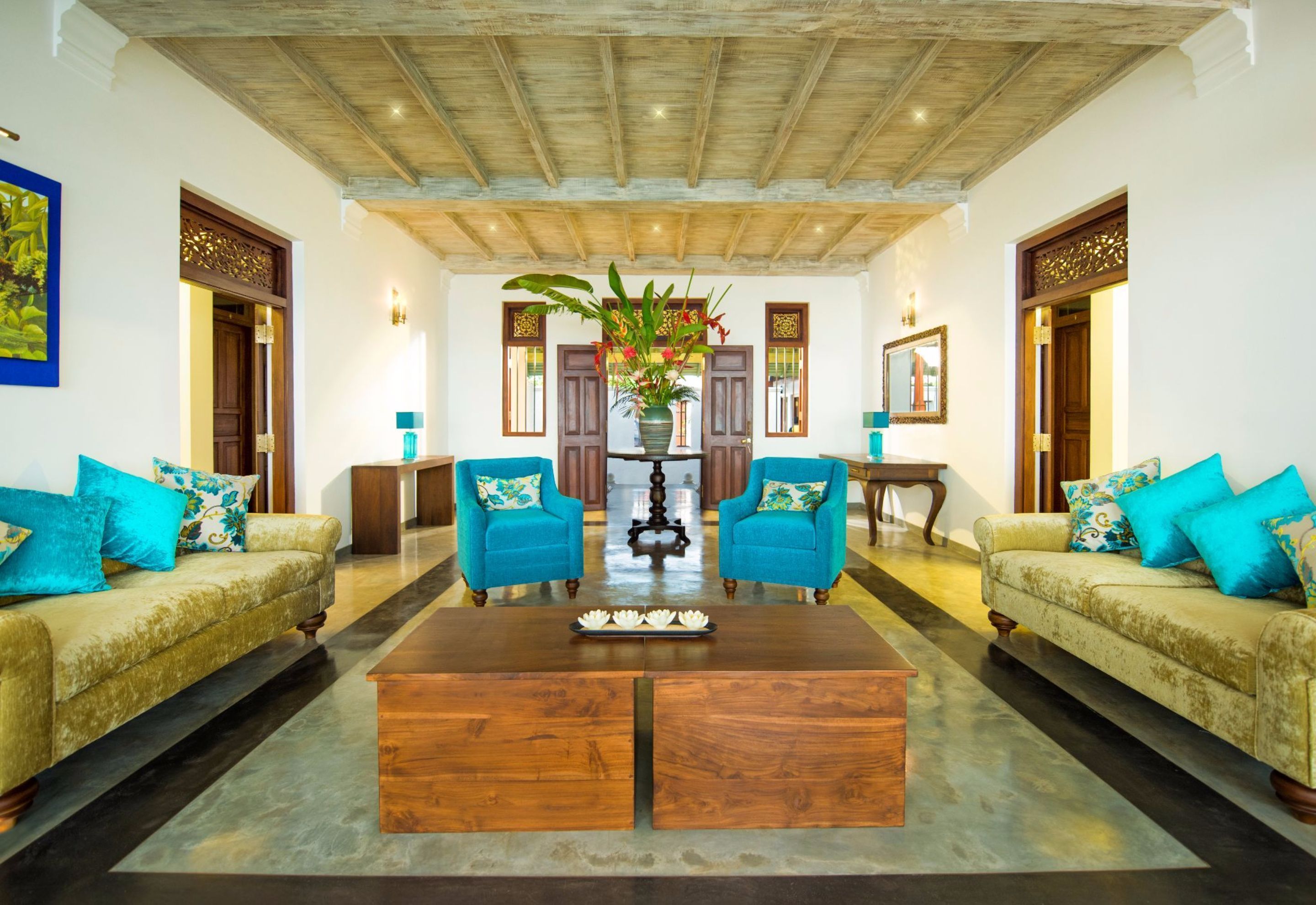 A spacious living room with two sofas, a coffee table, and a decorative centerpiece.