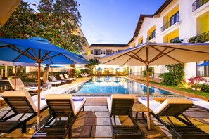 Outdoor pool, pool umbrellas, sun loungers