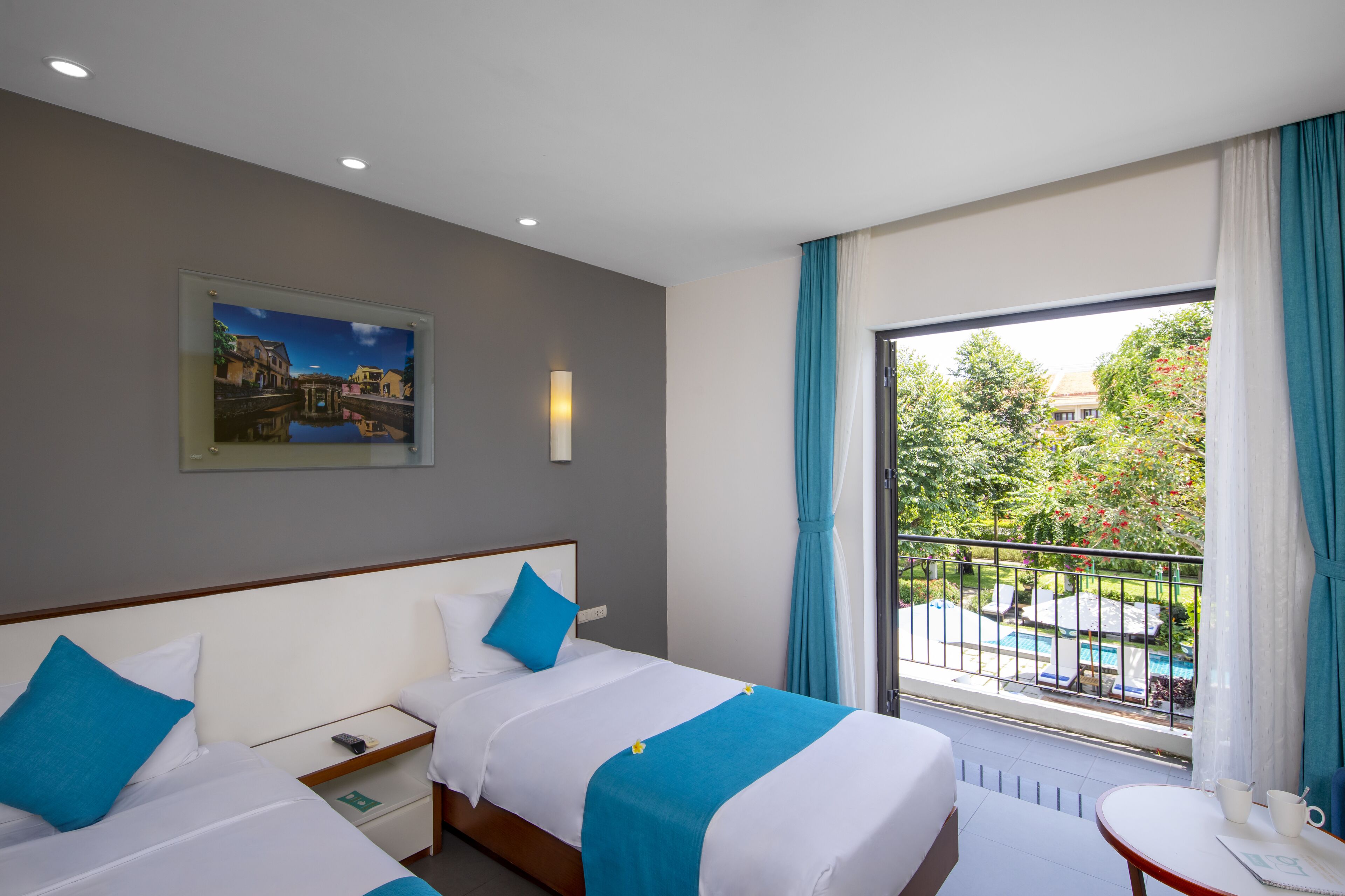 Deluxe Twin Room, Balcony, Pool View | Minibar, in-room safe, desk, blackout drapes
