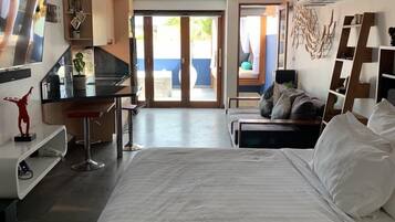Design Studio Suite, 1 King Bed, City View | 1 bedroom, in-room safe, blackout curtains, iron/ironing board