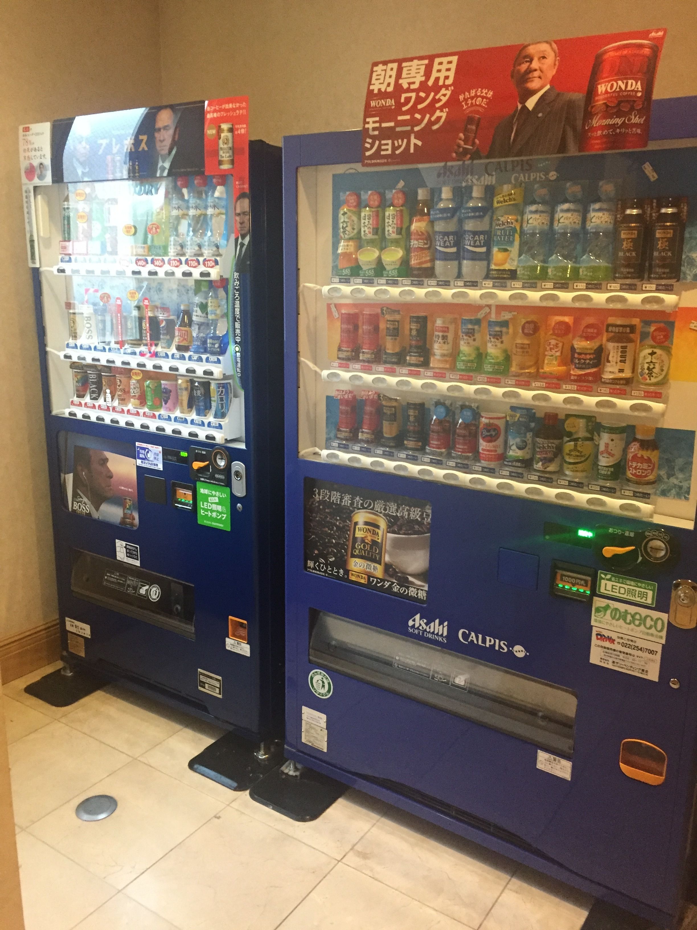 Two vending machines with various beverages and snacks.