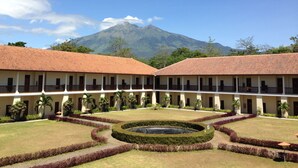 A courtyard with a pool, surrounded by a building with a tiled roof and multiple windows. - d'Emmerick Salib Putih Hotel Salatiga (Salatiga)