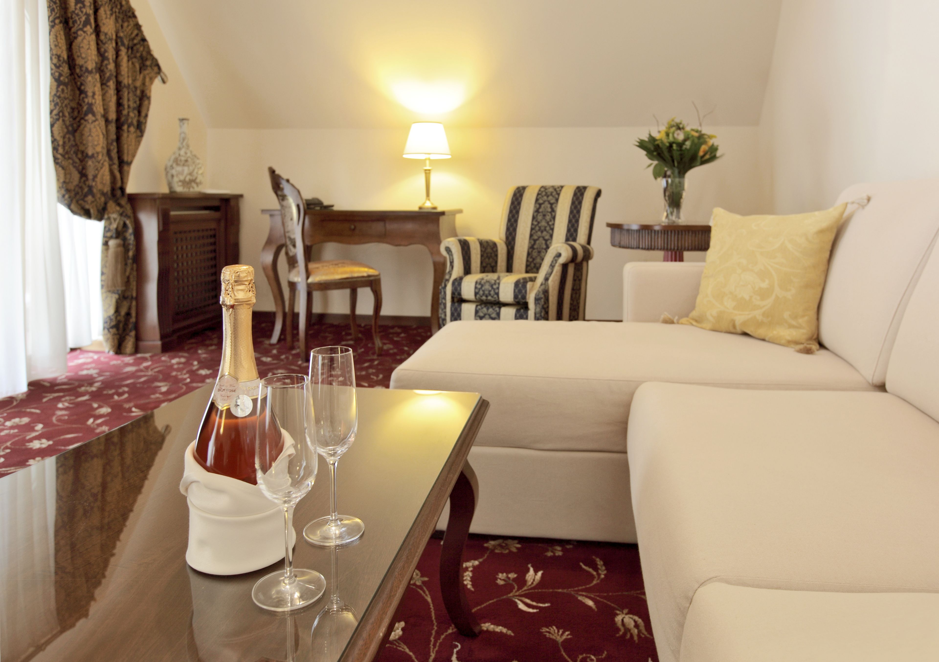 deluxe suite (with spa access) | living area | flat-screen tv