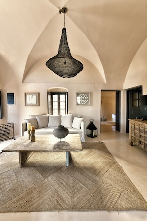 Amare Villa by K&K | Living area | 1-cm flat-screen TV with cable channels, TV - OIA Unique Homes by K&K (Santorini)