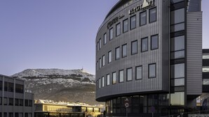 A modern building with a sign reading 'Hotel Restaurant.' - Prize by Radisson, Solheimsviken Bergen (Bergen)