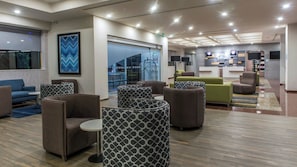 A modern lobby with seating areas, a staircase, and a reception desk. - Holiday Inn Express Mexico - Toreo by IHG (Naucalpan)