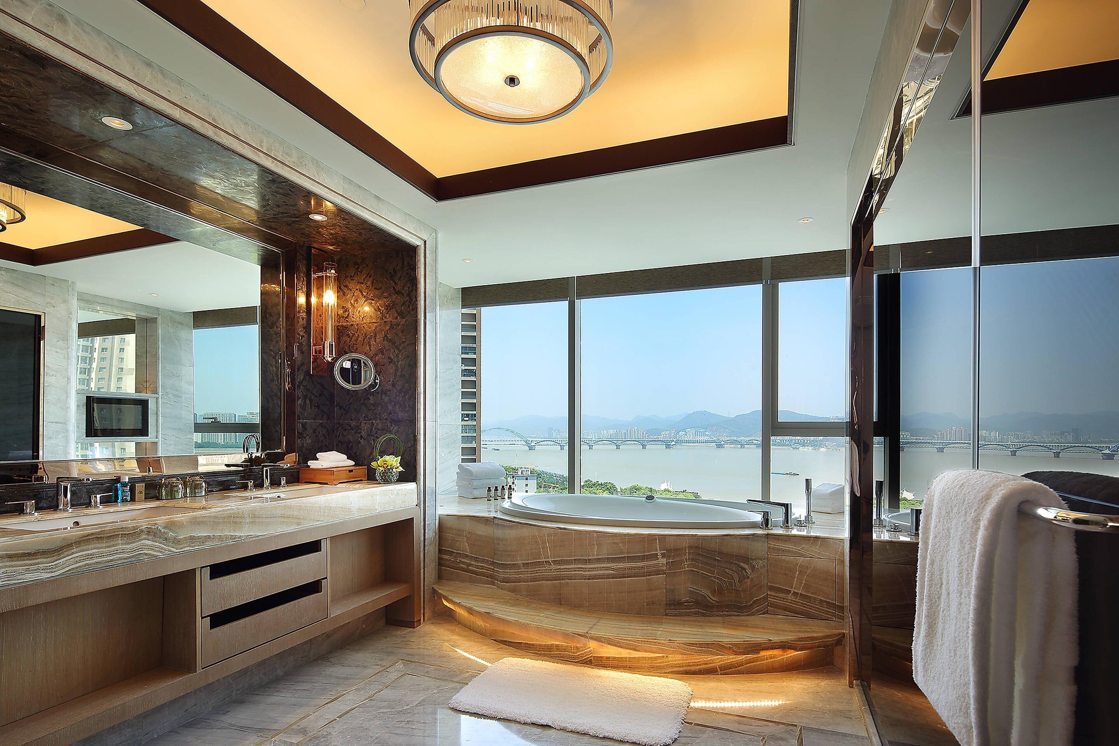 separate bathtub and shower, rainfall showerhead, hair dryer, bathrobes