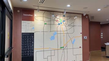 A large wall map with a weather forecast and a sign reading "TowneMap."