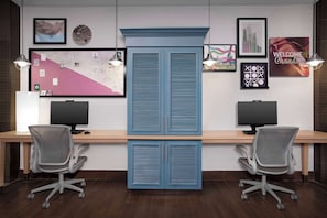 Work in comfort with a dual-monitor desk setup and high-back office chairs.