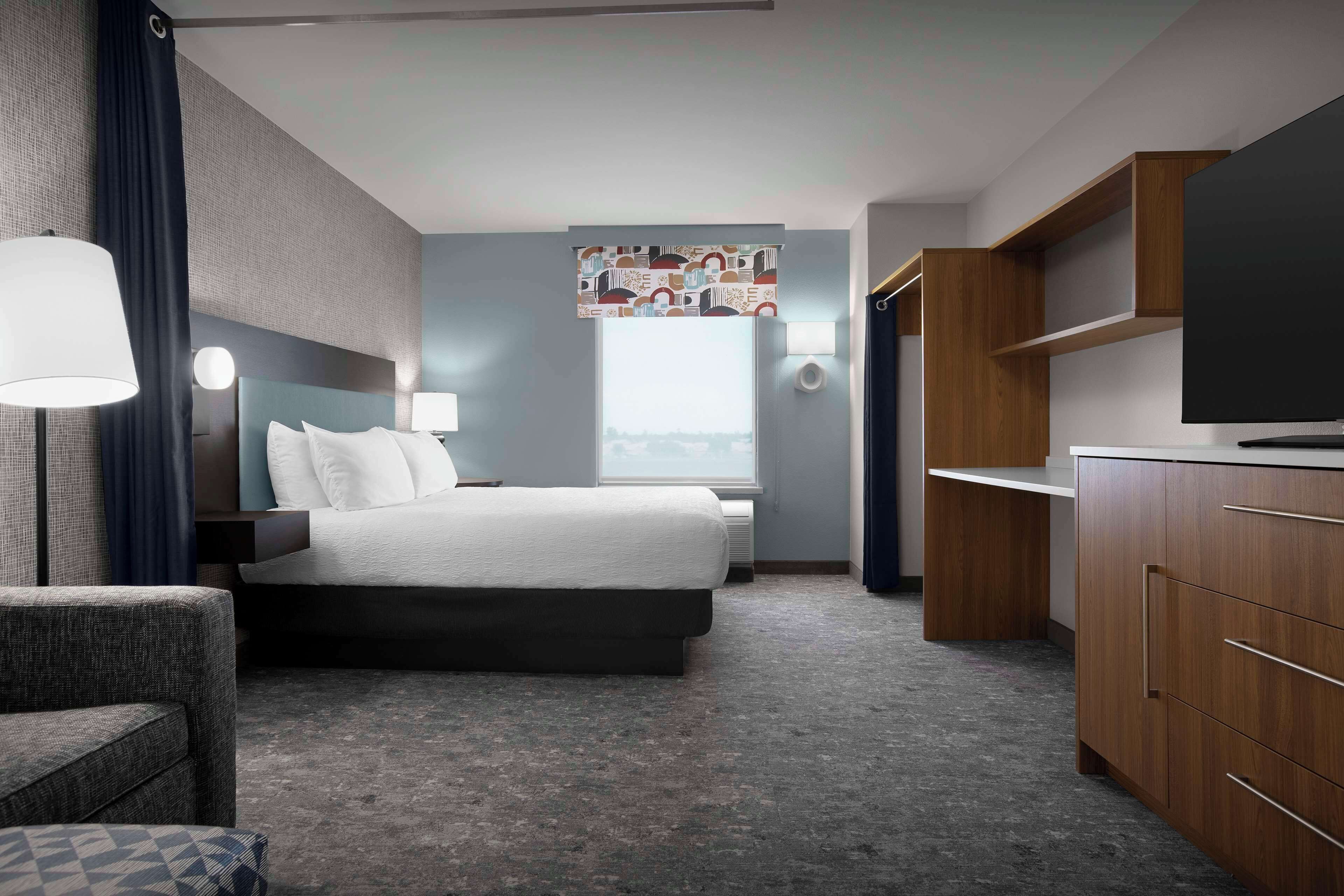 desk, laptop workspace, blackout curtains, iron/ironing board