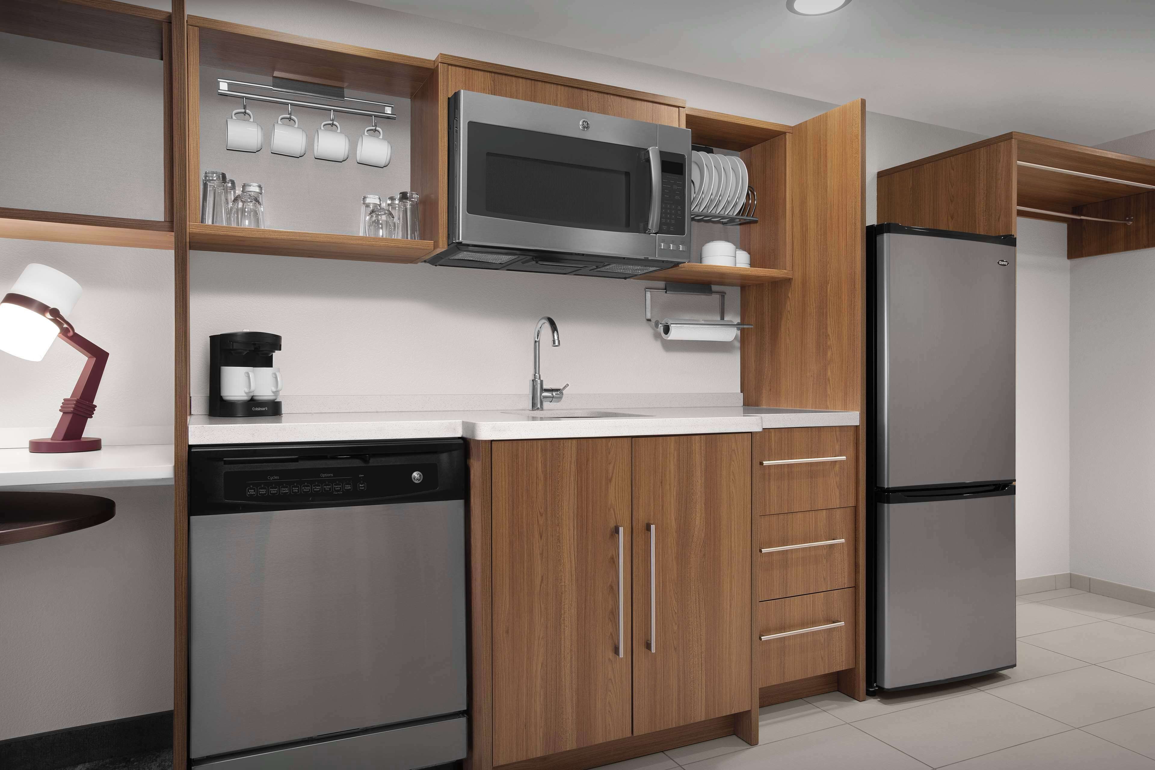 full-sized fridge, microwave, dishwasher, cookware/dishes/utensils