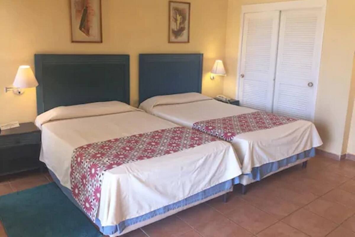 In-room safe, blackout curtains, bed sheets