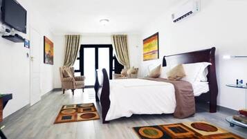 Main Room | Premium bedding, in-room safe, iron/ironing board, free WiFi
