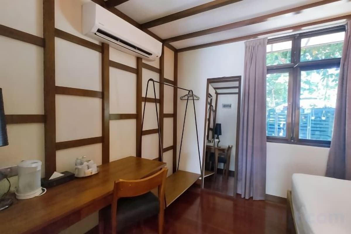 Desk, blackout curtains, iron/ironing board (on request), bed sheets