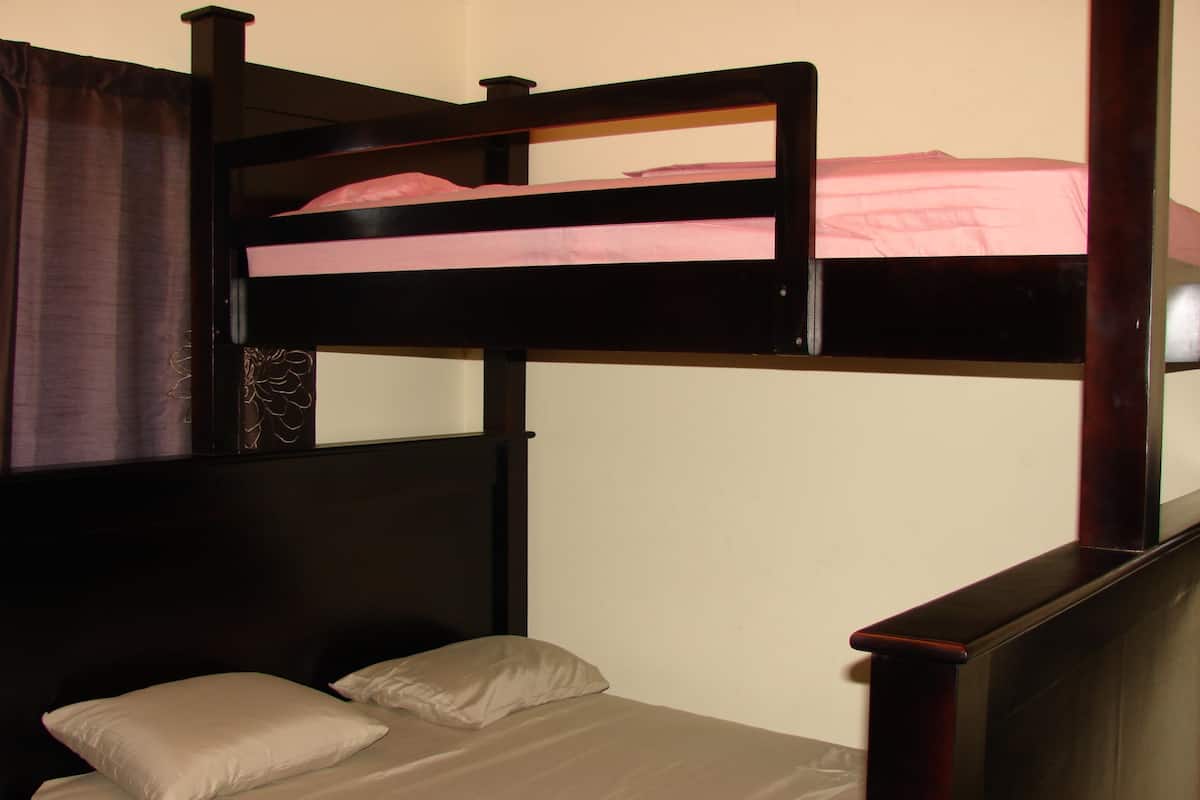 A bunk bed with a lower bed and a top bunk.