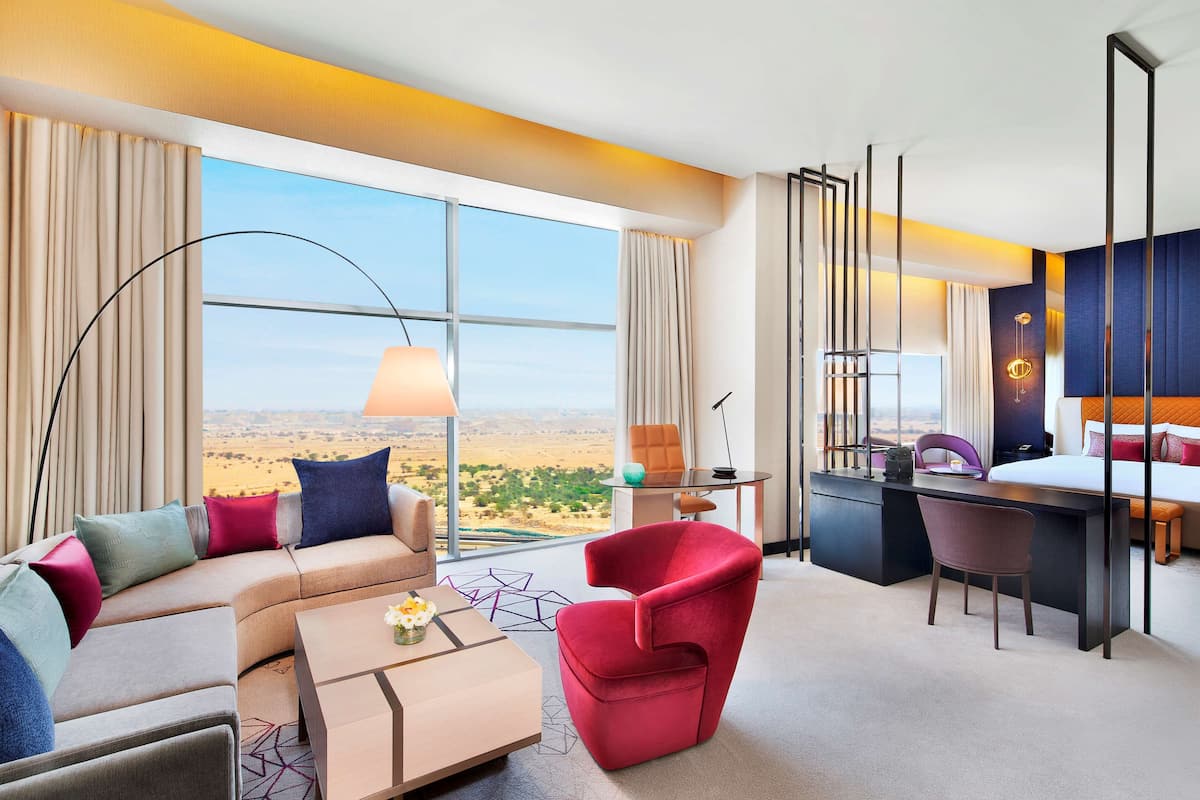 Deluxe Suite, 1 King Bed | Living area | 48-inch LCD TV with digital channels, TV, iPod dock