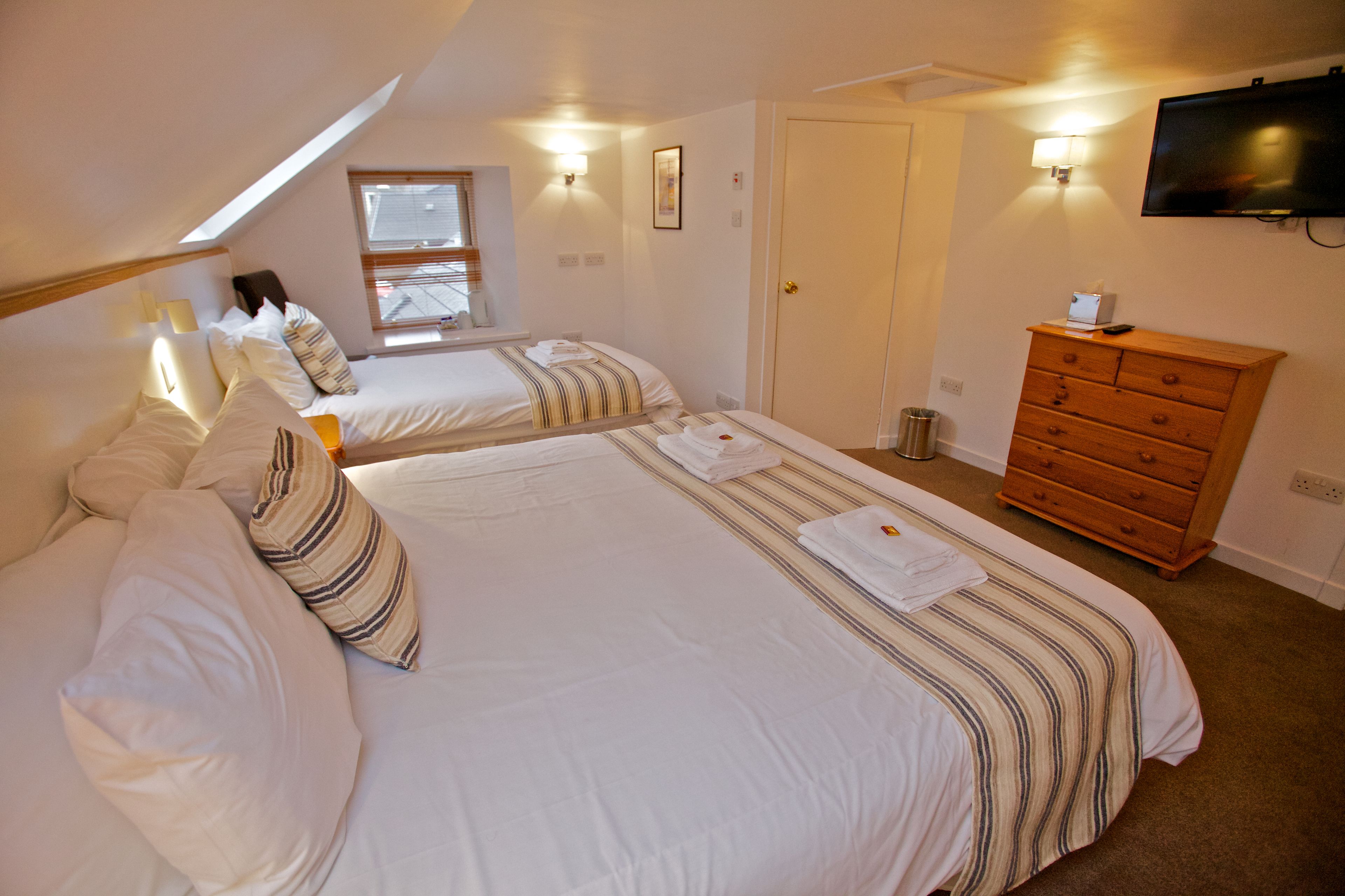 family room (ferry inn) | in-room safe, individually decorated, individually furnished, desk