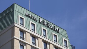 A hotel named "HOTEL PREZIO" with a green facade and multiple windows. - Shizutetsu Hotel Prezio Shizuoka Station Kita (Shizuoka)