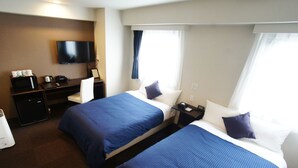 A hotel room with two beds, a TV, a desk with a computer, and a coffee maker. - HOTEL LiVEMAX Kasai Ekimae (Tokyo)