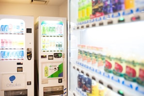 Vending machines with various drink options and a prominent 'Otsuka' logo.