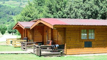 Wooden cottage with shared outdoor bathroom