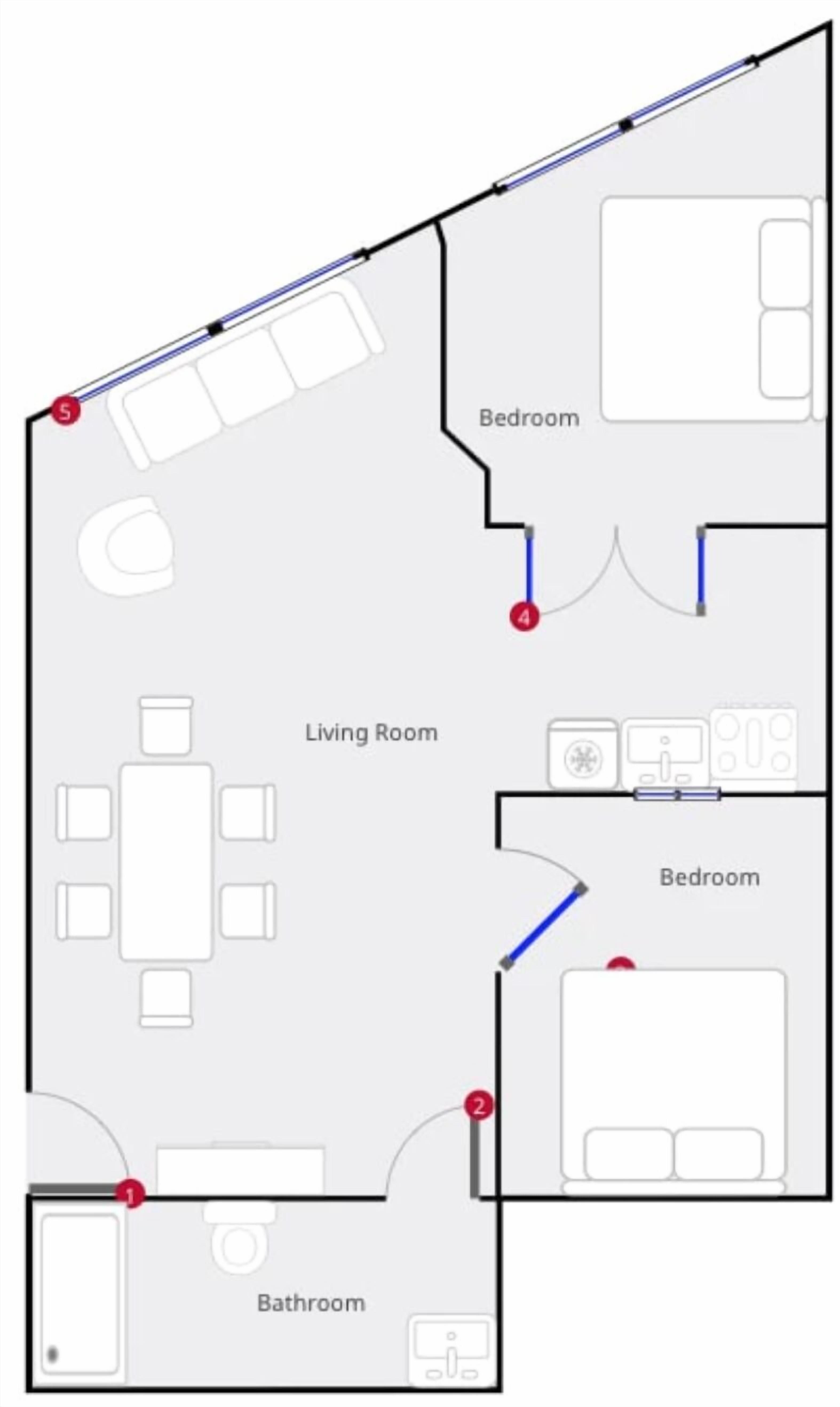A floor plan of a hotel room with a living room, two bedrooms, and a bathroom.