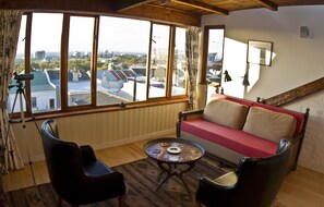 Standard Loft, 1 Bedroom | Living area | Flat-screen TV