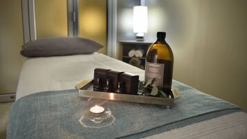 Relax in a stylishly appointed room with a comfortable bed, nightstand, and convenient amenities.