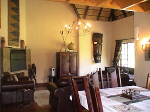 Family Chalet, 4 Bedrooms (Dbl-Storey Luxury Chalet 8 Sleeper) | Living area | Flat-screen TV, fireplace, DVD player - Champagne Haven (Cathkin Park)