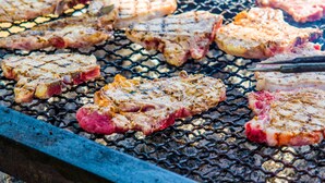 Steaks being grilled on a barbecue. - Snowflake 1 Bed plus Den 2 Bath (Copper Mountain)