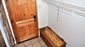 A wooden door with a metal shelf above it. - Snowflake 1 Bed plus Den 2 Bath (Copper Mountain)