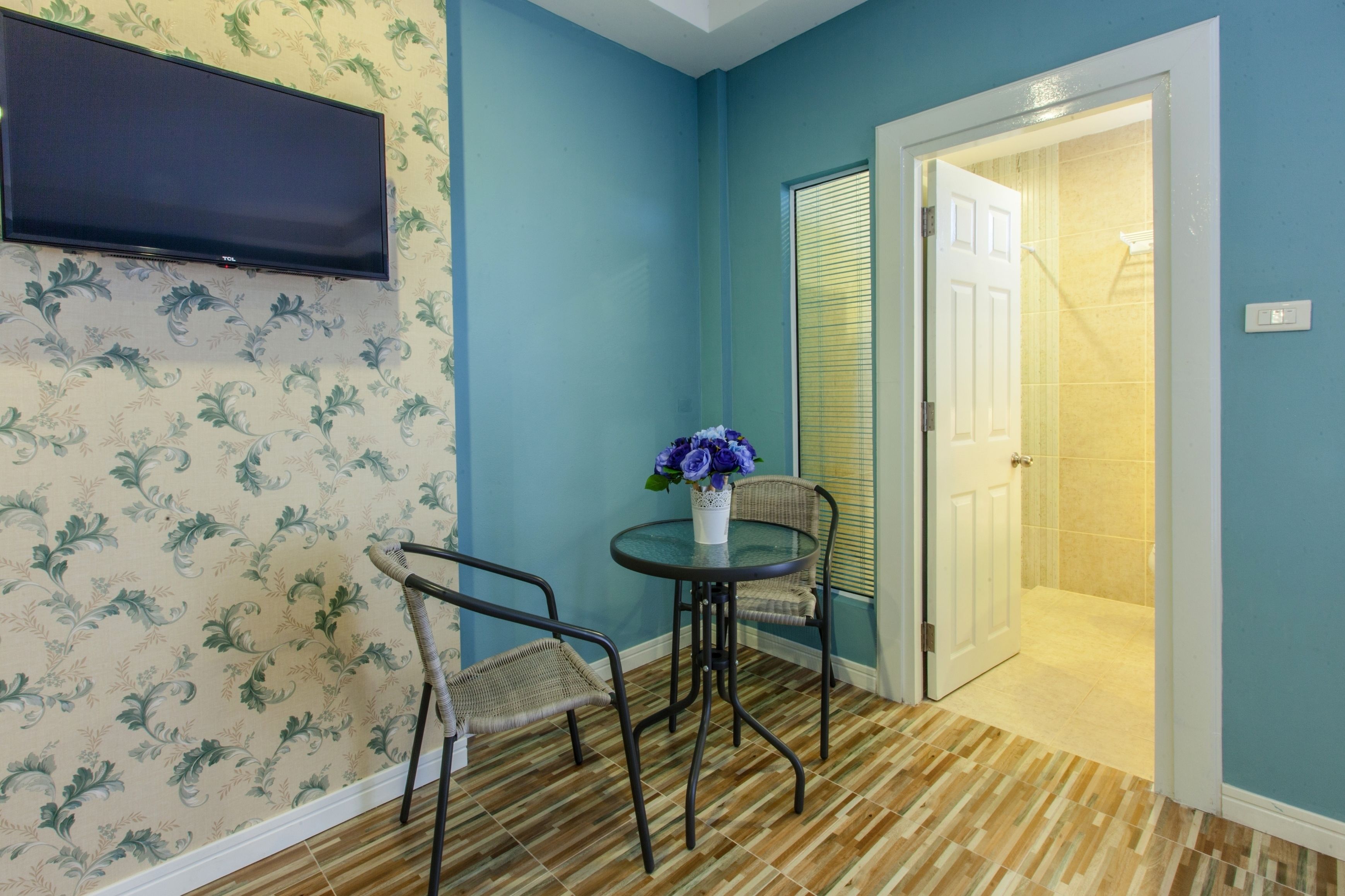 deluxe triple room | living area | 32-inch lcd tv with cable channels, tv