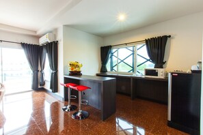 Lake View Suite | Living area | 32-inch LCD TV with cable channels, TV - Gallery Lake View Hotel (Khon Kaen)