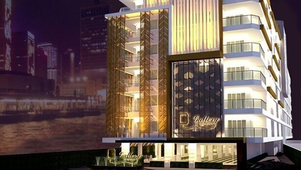 A modern building with a prominent entrance and a sign that reads "Gallery." - Gallery Lake View Hotel (Khon Kaen)