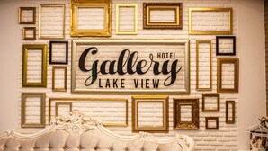 A wall with a white brick pattern and a sign that reads "Gallery Lake View Hotel". - Gallery Lake View Hotel (Khon Kaen)