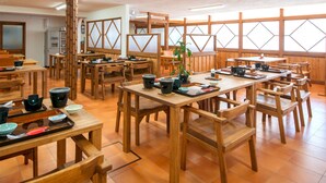 A traditional Japanese restaurant with wooden furniture and tatami mats. - Shiretoko Village (Shari)