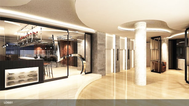 A modern lobby with a curved reception desk, a glass partition, and a central column. - Grand 5 Hotel & Plaza Sukhumvit Bangkok (Bangkok)