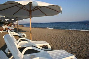 On the beach, sun-loungers, beach umbrellas