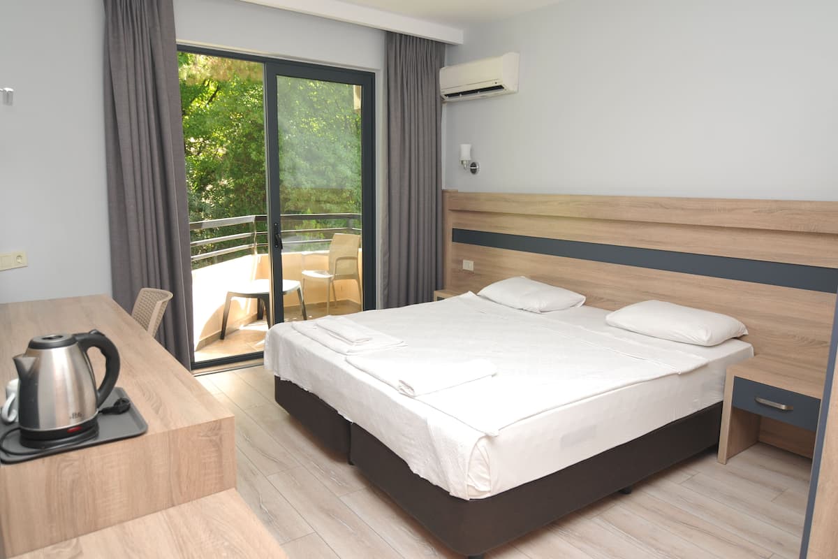 Standaard kamer, 1 twee- of 2 eenpersoonsbedden | 1 slaapkamer, een kluis op de kamer, gratis wifi