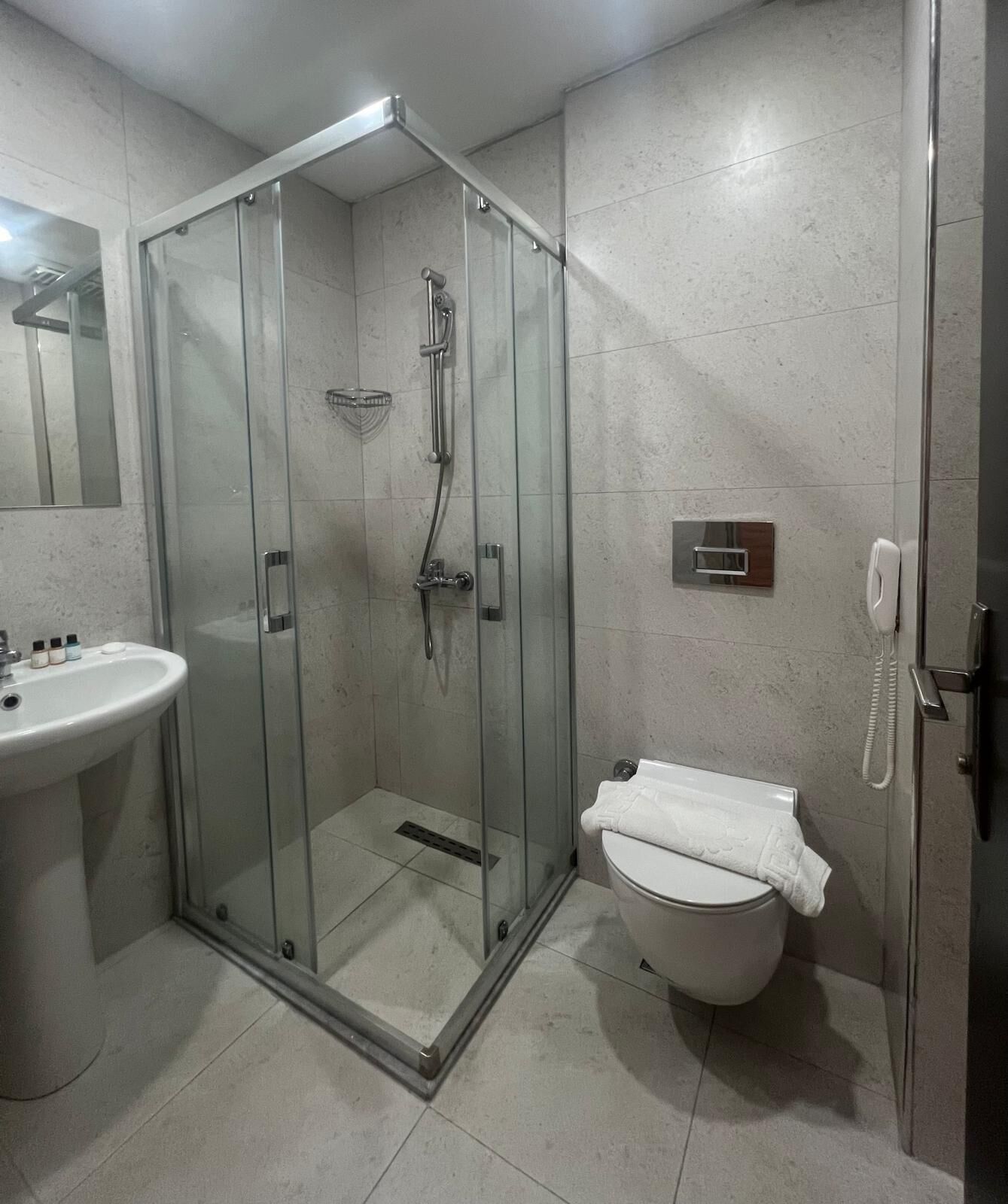 economy double or twin room | bathroom | shower, hair dryer, slippers, towels
