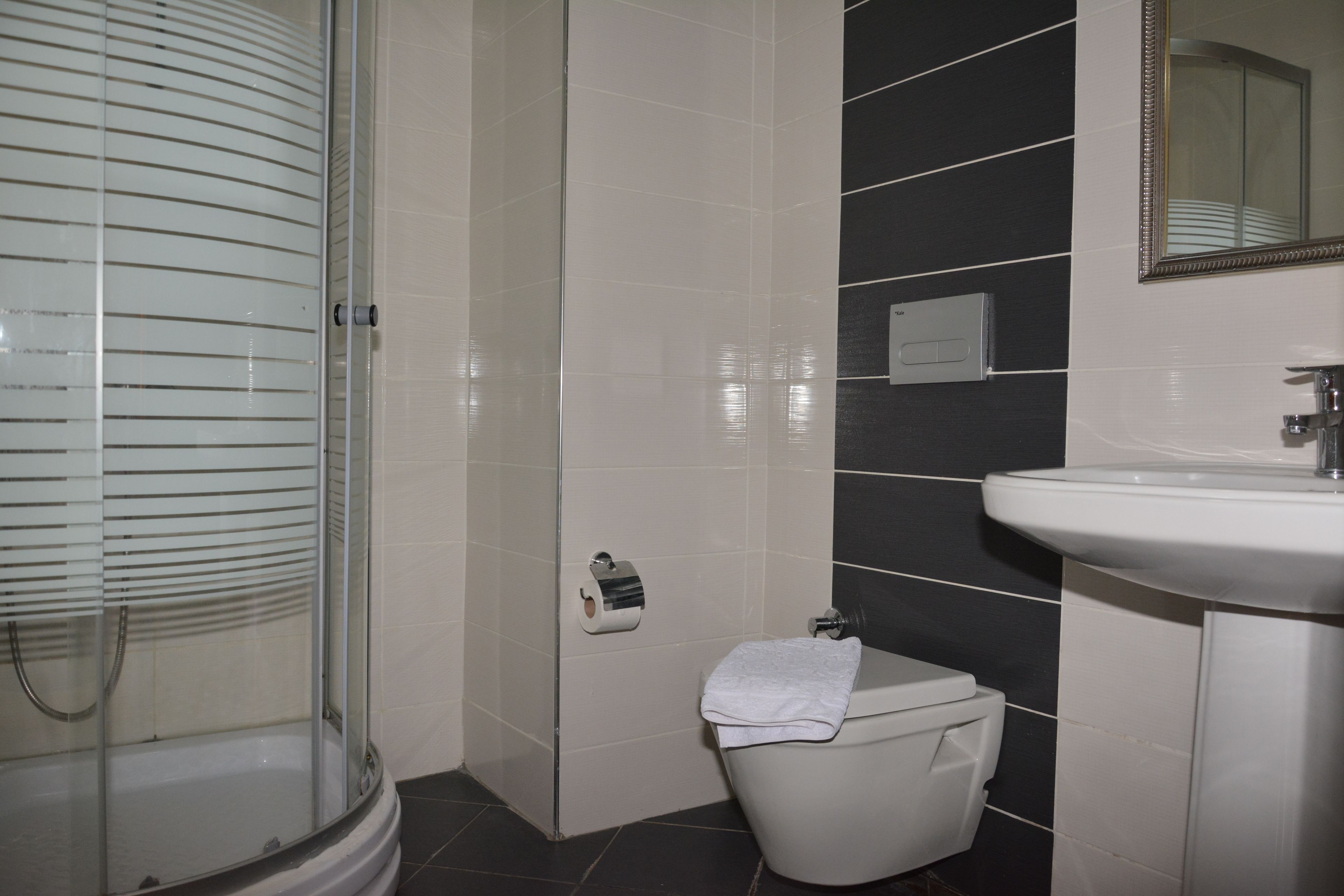 standard double or twin room | bathroom | shower, hair dryer, slippers, towels