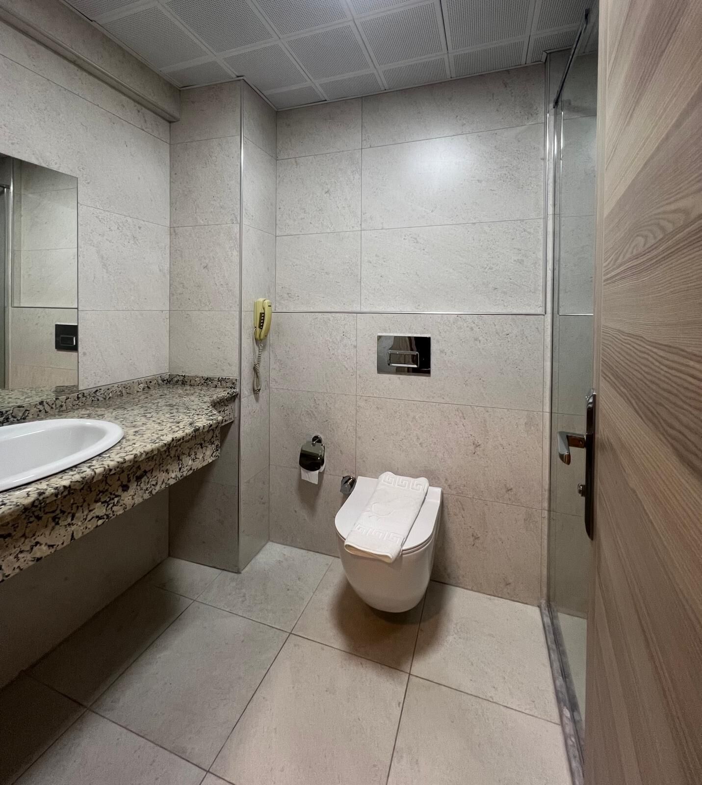 superior apartment | bathroom | shower, hair dryer, slippers, towels