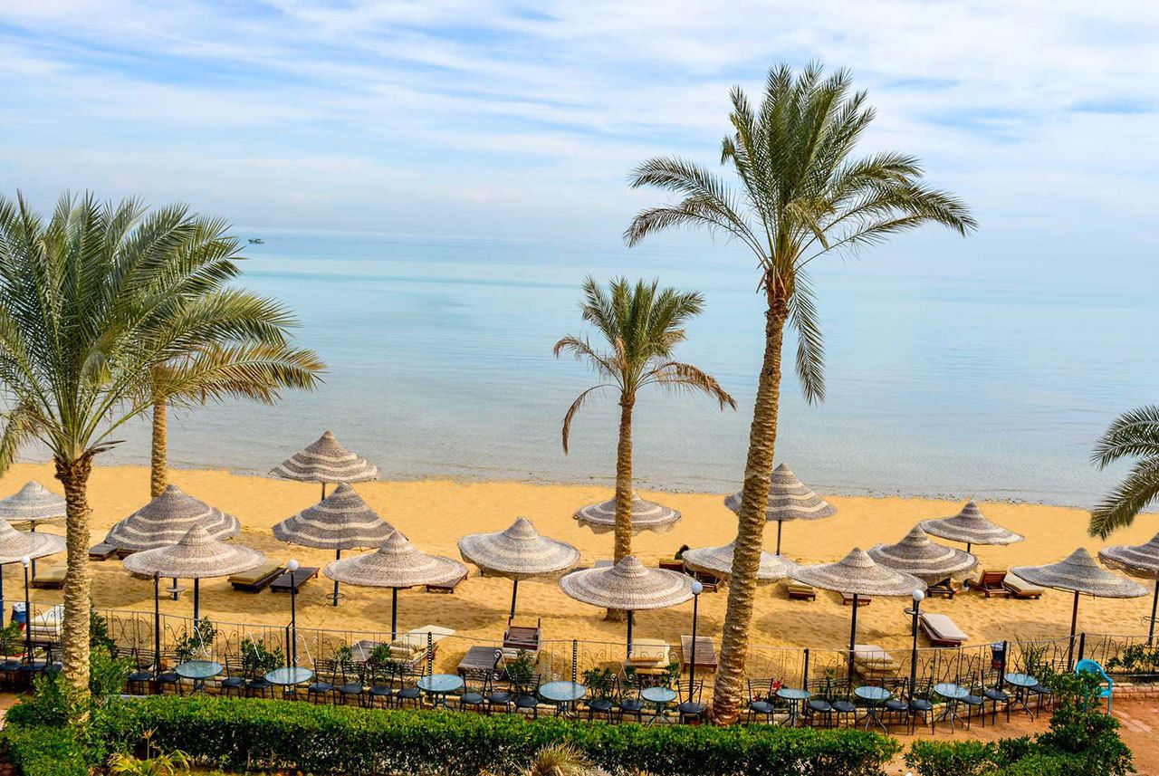 On the beach, sun-loungers, beach umbrellas, beach towels