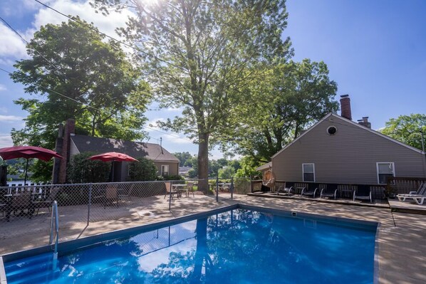 Seasonal outdoor pool, pool umbrellas, pool loungers