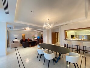 Guinea Suite | Living area | TV, fireplace - Grand Hotel Djibloho (Djibloho)