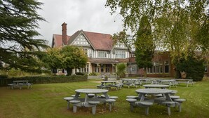 A traditional Tudor-style building with a red-tiled roof and white timber framing. - The Chase Hotel by Greene King Inns (Nuneaton)